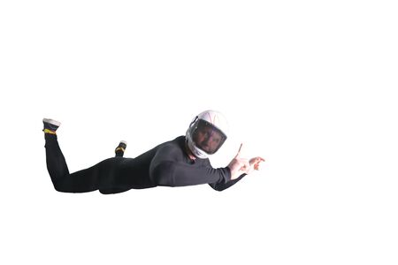 One finger. Men in parachute equipment and helmet show one finger. Teampleat skydiver.の写真素材