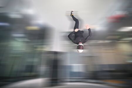 Five finfers. Men in parachute shows five fingers. Gesture by fingers. Skydiving sport.の写真素材
