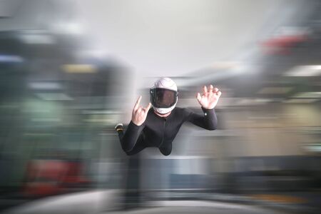 Two fingers. Fly men shows two fingers. Sky diver gestures by fingers. Teampleat skydiver.の写真素材