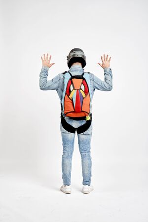 Ten fingers. Men in parachute shows ten fingers. Gesture by fingers. Skydiving sport.の写真素材