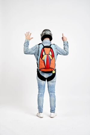Six finfers. Men in parachute shows six fingers. Gesture by fingers. Skydiving sport.の写真素材
