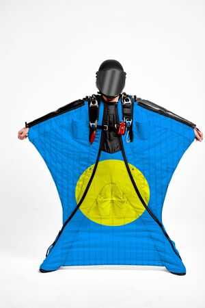 Palau extreme. Men in wing suit templet. Skydiving men in parashute. Simulator of free fall.の写真素材