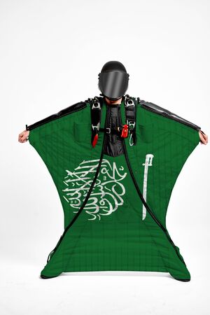 Saudi Arabia extreme. Men in wing suit templet. Skydiving men in parashute. Simulator of free fall.の写真素材