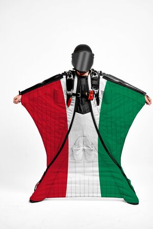 Hungary extreme. Men in wing suit templet. Skydiving men in parashute. Simulator of free fall.の写真素材