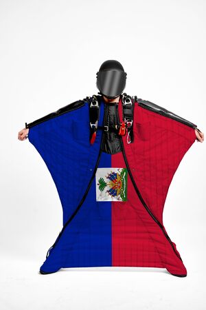 Haiti extreme. Men in wing suit templet. Skydiving men in parashute. Simulator of free fall.の写真素材