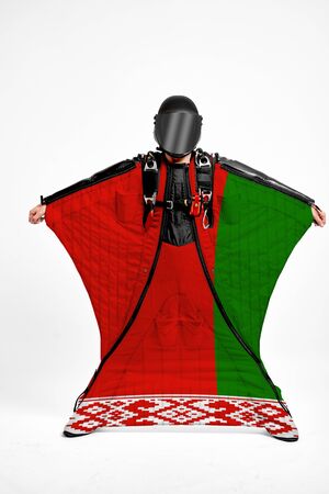 Belarus extreme. Men in wing suit templet. Skydiving men in parashute. Simulator of free fall.の写真素材