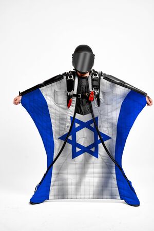 Israel extreme. Men in wing suit templet. Skydiving men in parashute. Simulator of free fall.の写真素材