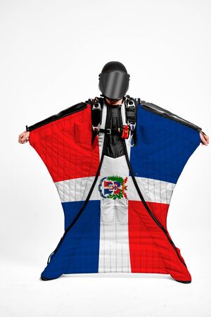 Dominican Republic extreme. Men in wing suit templet. Skydiving men in parashute. Simulator of free fall.の写真素材