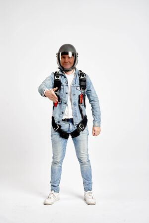 Greeting gesture. Fly men shows greeting gesture with hands. Sky diver gestures by fingers. Teampleat skydiver.の写真素材