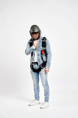 Parachutist. Fly men in parachute equipment. Extreme sport. Teampleat skydiver.の写真素材
