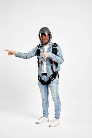 Finger in the side. Fly men shows finger in the side. Sky diver gestures by fingers. Teampleat skydiver.の写真素材