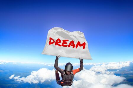 Dream. Men in parachute equipment. Skydiving sport. Extreme hobby as a way of life. Parachuting. Men in free fall.の写真素材