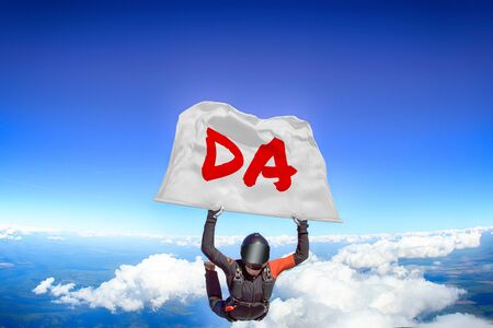 Da. Men in parachute equipment. Skydiving sport. Extreme hobby as a way of life. Parachuting. Men in free fall.の写真素材