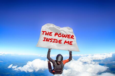 The power inside me. Men in parachute equipment. Skydiving sport. Extreme hobby as a way of life. Parachuting. Men in free fall.の写真素材