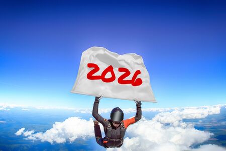 2026. Men in parachute equipment. Skydiving sport. Extreme hobby as a way of life. Parachuting. Men in free fall.の写真素材