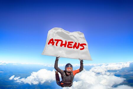 Athens. Flag in skydiving. People in free fall.Teampleat skydiver. Extreme sport.の写真素材