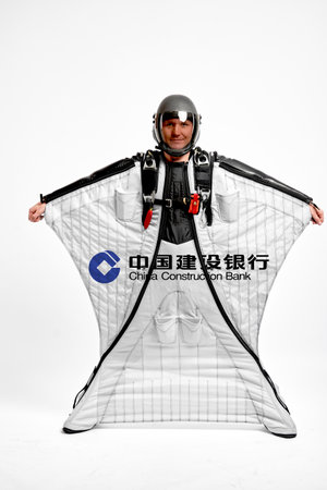 China Construction Bank. Bird men. Men in wing suit equipment.Demonstration of popular brands. Simulator of free fall.のeditorial素材