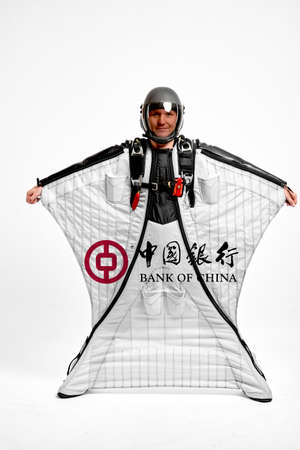 Bank of China. Bird men. Men in wing suit equipment.Demonstration of popular brands. Simulator of free fall.のeditorial素材