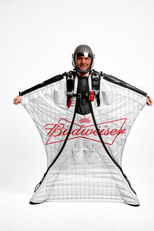 Budweiser. Bird men. Men in wing suit equipment.Demonstration of popular brands. Simulator of free fall.のeditorial素材