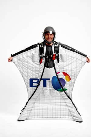 BT Group. Bird men. Men in wing suit equipment.Demonstration of popular brands. Simulator of free fall.のeditorial素材