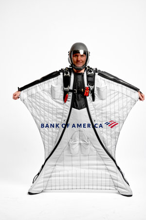 Bank of America. Bird men. Men in wing suit equipment.Demonstration of popular brands. Simulator of free fall.のeditorial素材