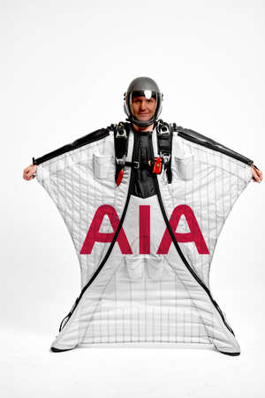AIA Group. Bird men. Men in wing suit equipment.Demonstration of popular brands. Simulator of free fall.のeditorial素材