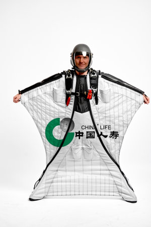 China Life. Bird men. Men in wing suit equipment.Demonstration of popular brands. Simulator of free...