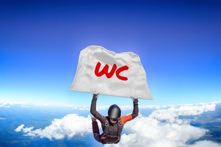 WC. Flag in skydiving. People in free fall.Teampleat skydiver. Extreme sport.のeditorial素材