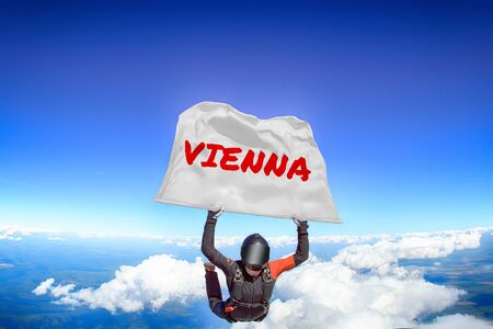 Vienna. Flag in skydiving. People in free fall.Teampleat skydiver. Extreme sport.のeditorial素材