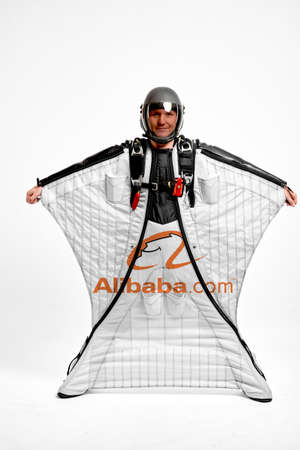 Alibaba Group. Bird men. Men in wing suit equipment.Demonstration of popular brands. Simulator of free fall.のeditorial素材