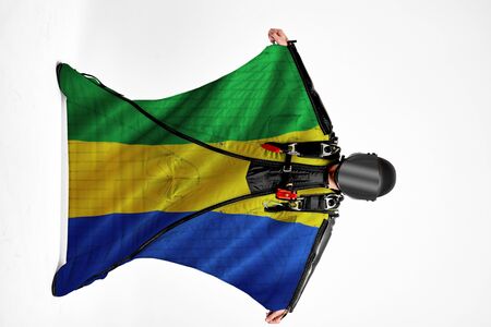 Gabon extreme travel. Simulator of free fall. Men in wing suit.の写真素材
