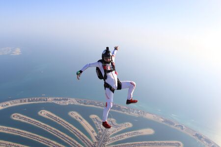 View. Emotions people prefer air sport. Flyer in white suit. The sky without borders.の写真素材