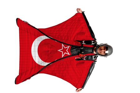 Turkish flag. Men in wing suit templet. Skydiving men in parashute. Simulator of free fall.の写真素材