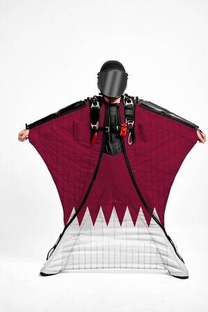 Qatar extreme. Men in wing suit templet. Skydiving men in parashute. Simulator of free fall.の写真素材