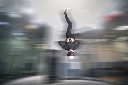 Heart with hands. Men in parachute shows heart with hands. Gesture by fingers. Skydiving sport.の写真素材