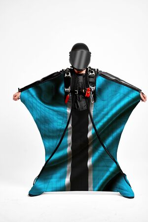Botswana extreme. Men in wing suit templet. Skydiving men in parashute. Simulator of free fall.の写真素材