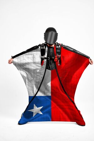 Chile extreme. Men in wing suit templet. Skydiving men in parashute. Simulator of free fall.の写真素材
