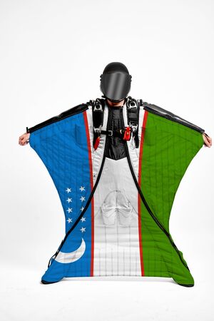 Uzbekistan extreme. Men in wing suit templet. Skydiving men in parashute. Simulator of free fall.の写真素材