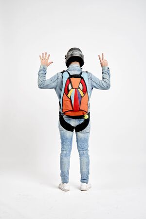 Seven fingers. Men in parachute shows seven fingers. Gesture by fingers. Skydiving sport.の写真素材