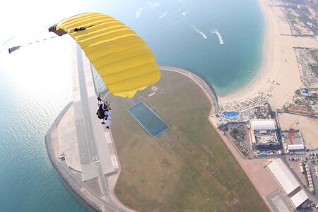 Speed. Extreme people prefere sky sport. Fly men perfoms trick in air. Parachutist in blue suit is in free fall. Skydiving is sport without rules.の写真素材