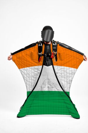 Ireland extreme. Men in wing suit templet. Skydiving men in parashute. Simulator of free fall.の写真素材