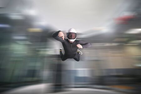 Point a finger. Men in parachute equipment points a finger. Skydiving sport. Extreme hobby as a way of life. Parachuting.の写真素材