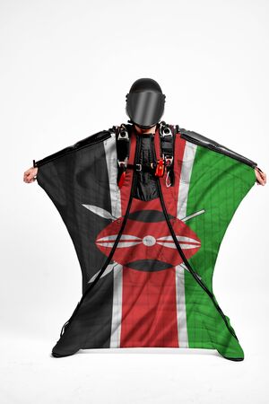 Kenya extreme. Men in wing suit templet. Skydiving men in parashute. Simulator of free fall.の写真素材