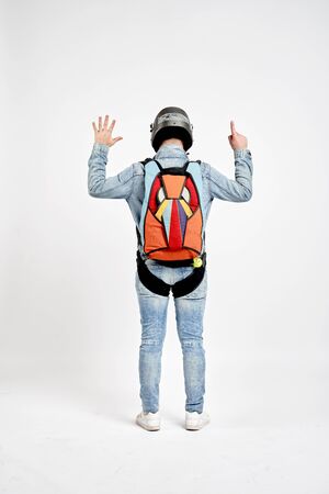 Six finfers. Men in parachute shows six fingers. Gesture by fingers. Skydiving sport.の写真素材