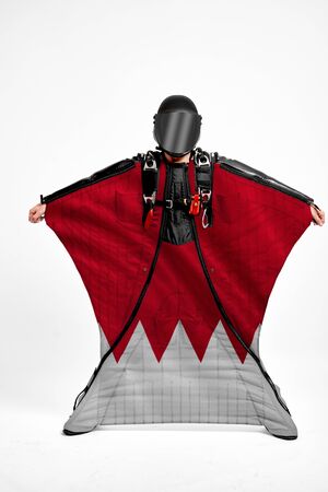 Bahrain extreme. Men in wing suit templet. Skydiving men in parashute. Simulator of free fall.の写真素材