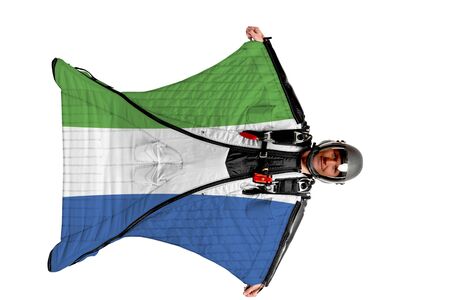 Sierra Leone flag. Men in wing suit templet. Skydiving men in parashute. Simulator of free fall.の写真素材
