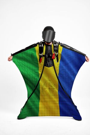 Gabon extreme. Men in wing suit templet. Skydiving men in parashute. Simulator of free fall.の写真素材