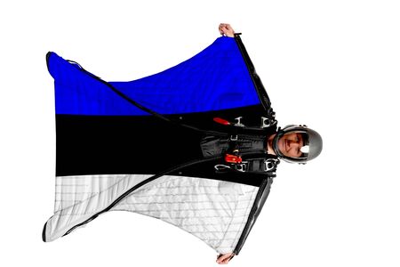 Estonia flag. Men in wing suit templet. Skydiving men in parashute. Simulator of free fall.の写真素材