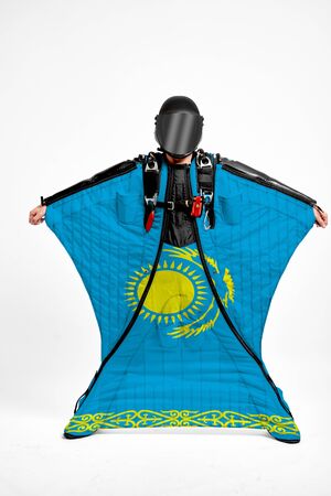 Kazakhstan extreme. Men in wing suit templet. Skydiving men in parashute. Simulator of free fall.の写真素材