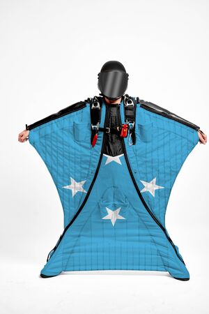 Federated States of Micronesia extreme.Men in wing suit templet. Skydiving men in parashute. Simulator of free fall.の写真素材